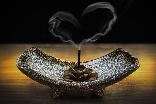 incense smoke forming a heart shape