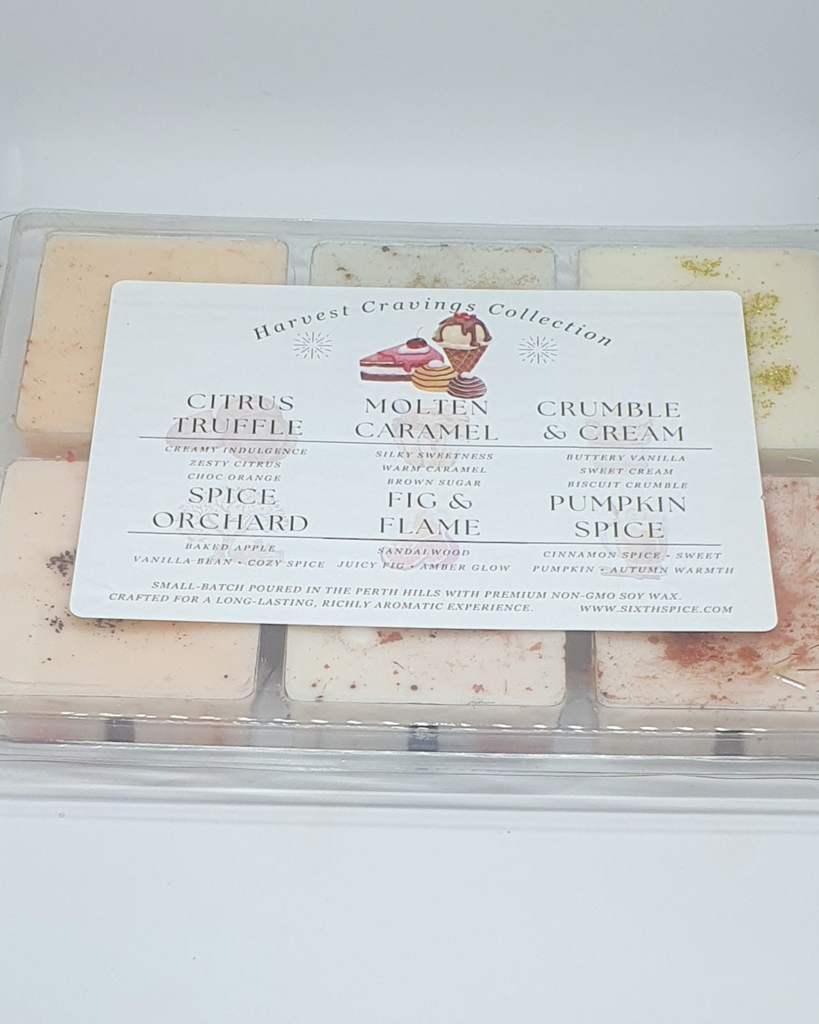 Assorted wax melt squares in a clear plastic packaging with a label on a white background