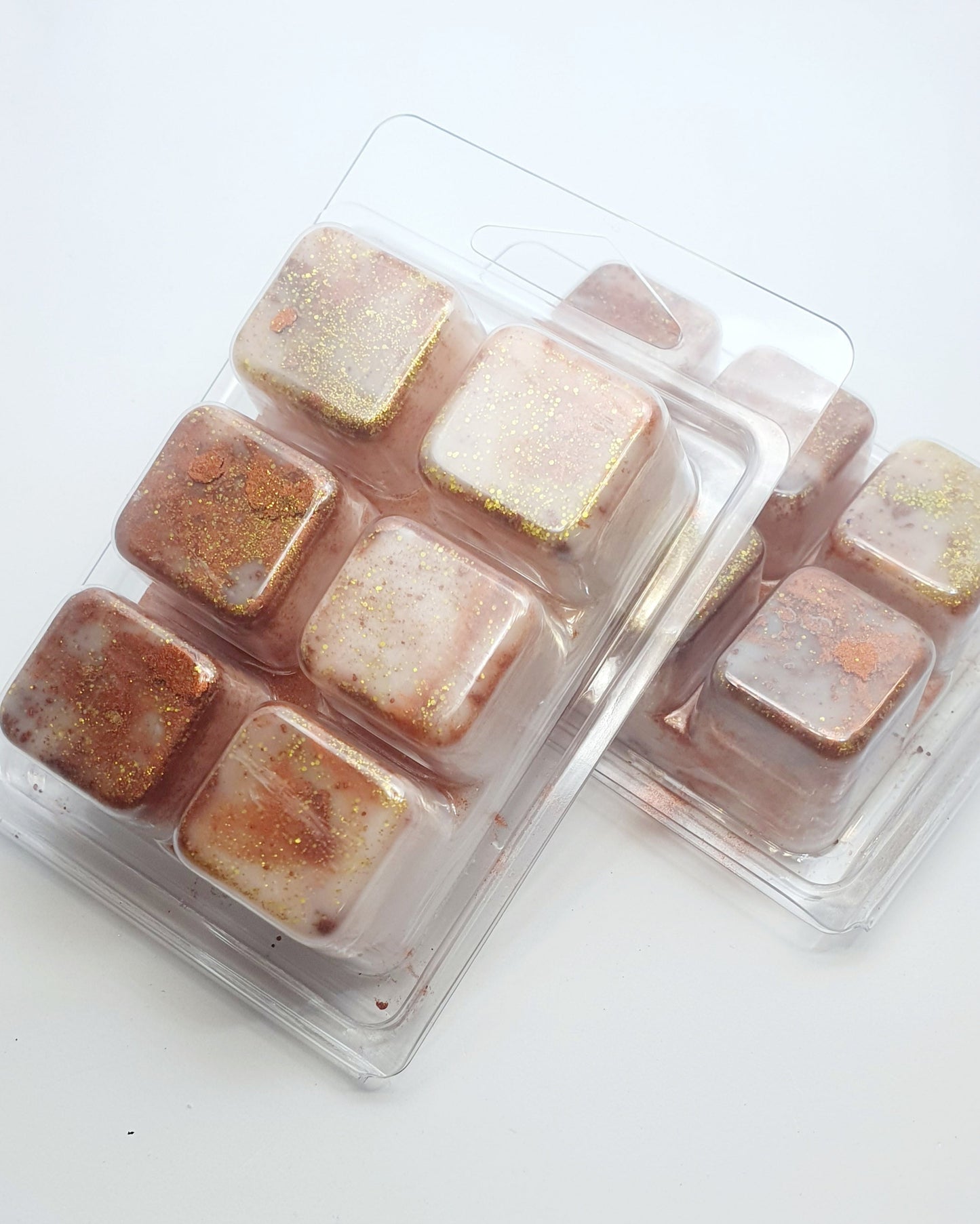 Square wax melts in a mold on a white background