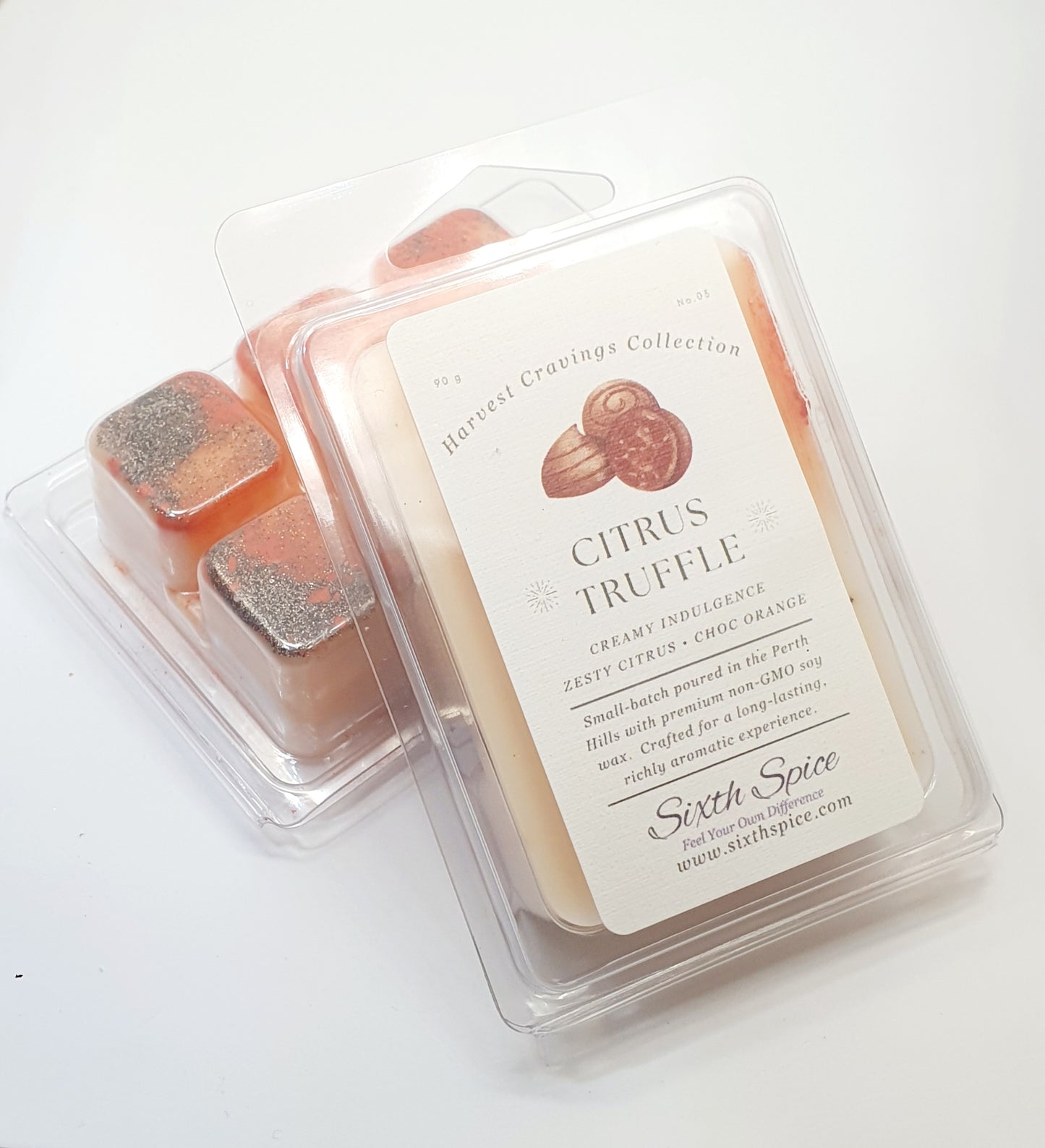 Packaged citrus truffle wax melts with a label on a white background